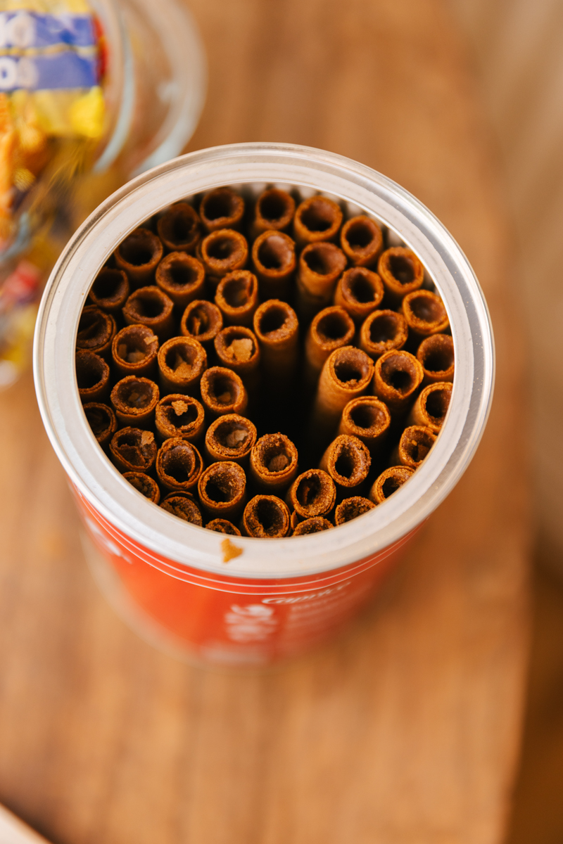 Close-up of chocolate wafer rolls as a table treat.