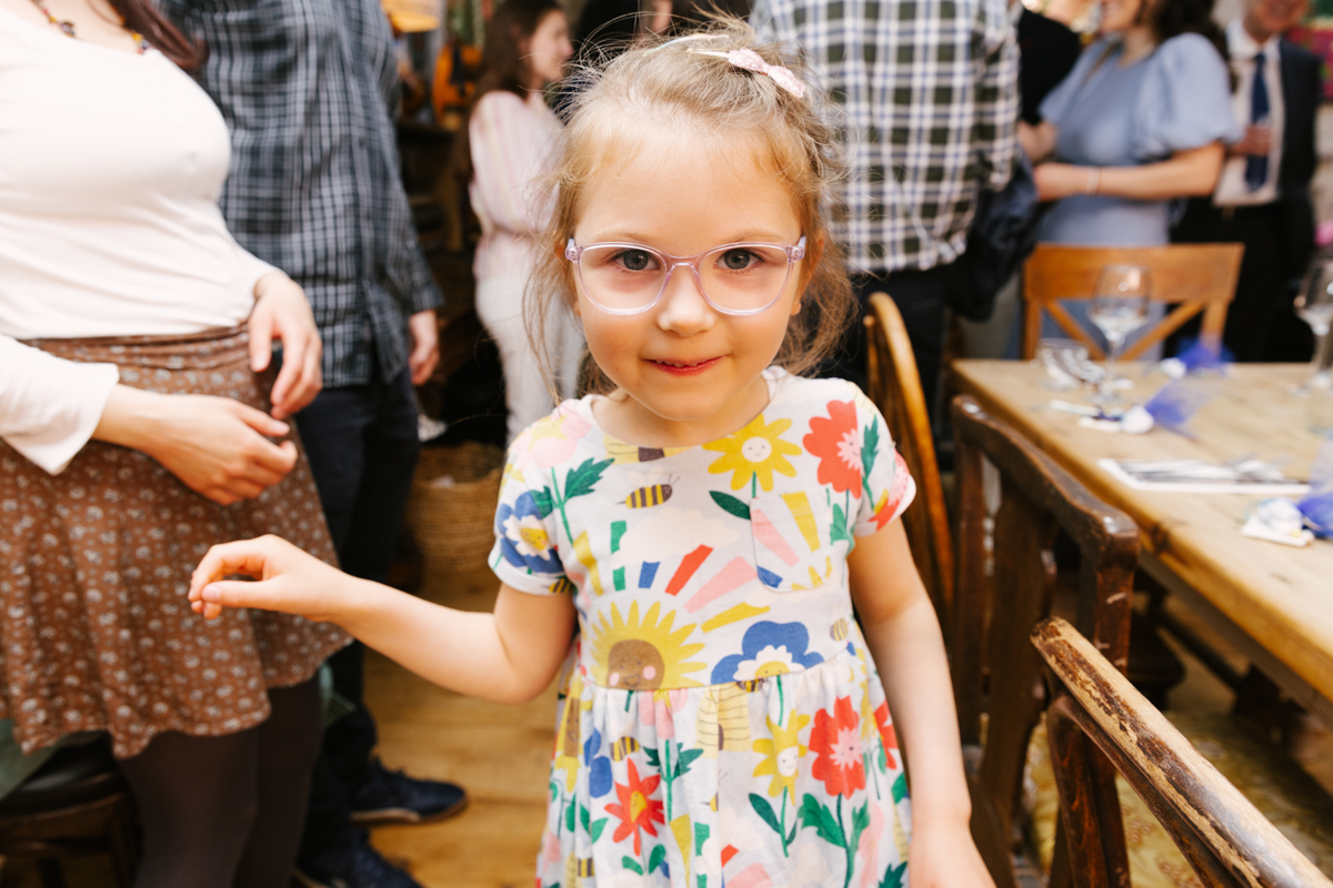 Young girl smiling and standing at the reception.