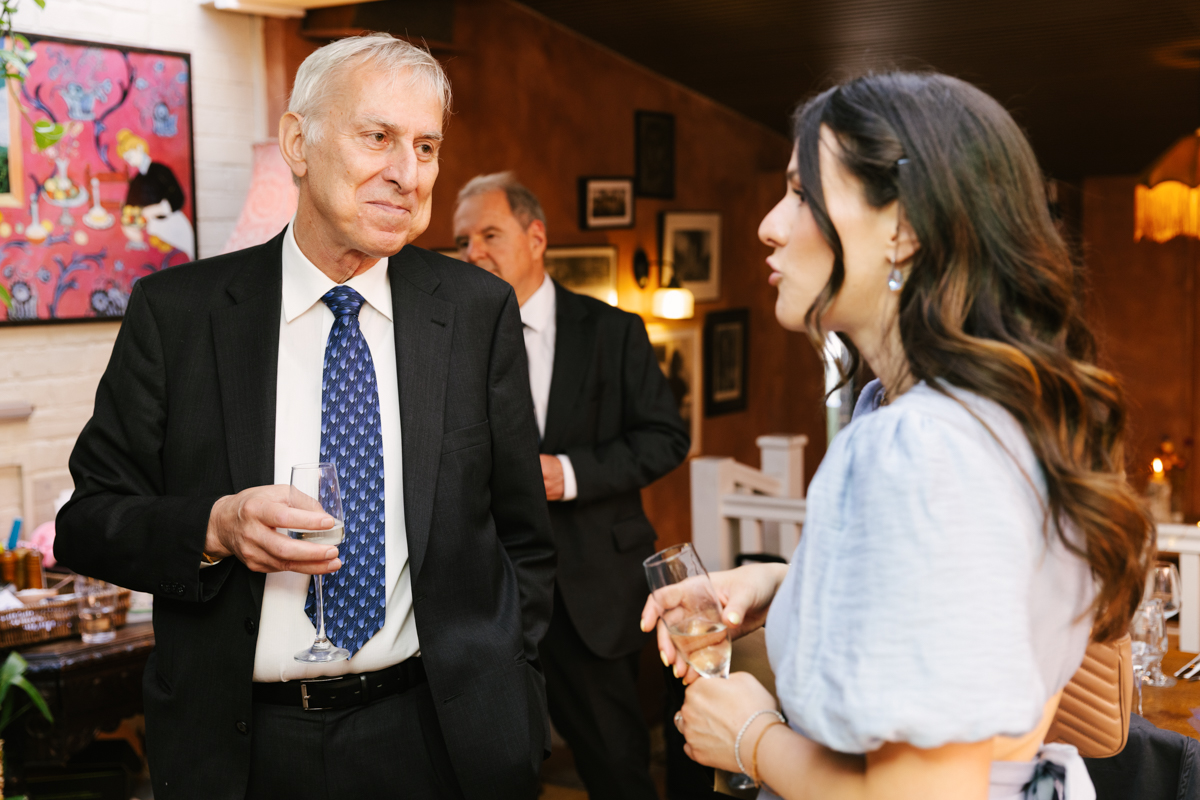 Grandfather chatting with the godmother at the reception.