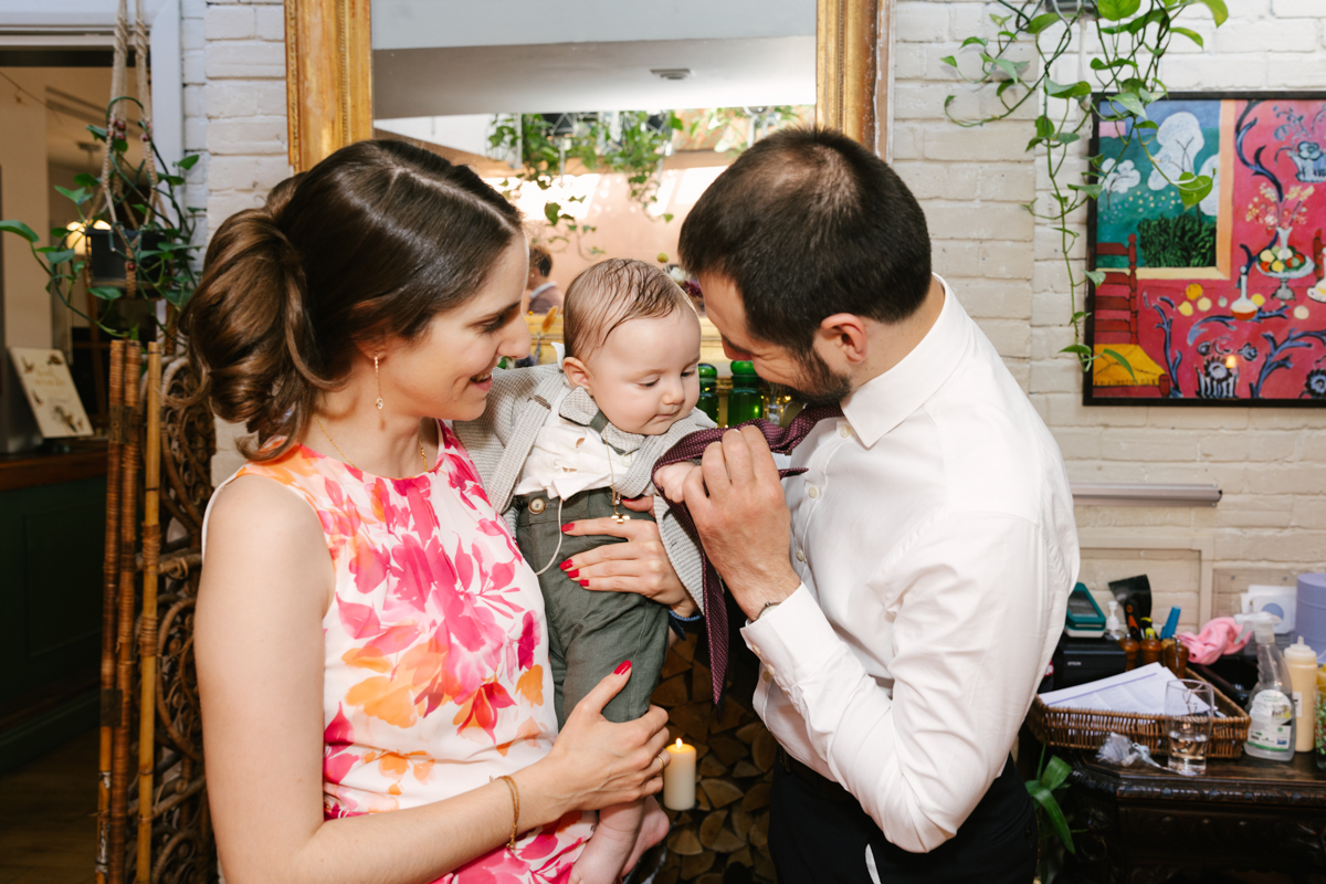 Father and mother with the baby at the reception.