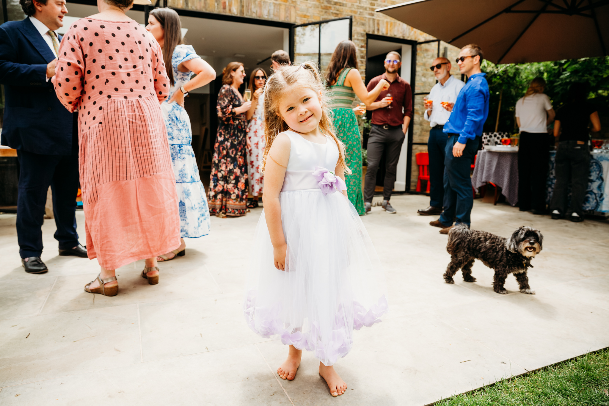 A little girl showing her dress.
