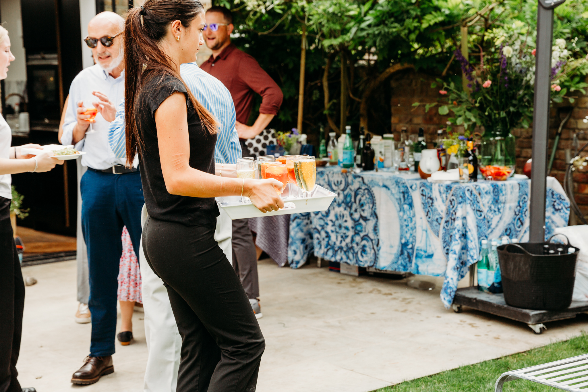 A A waitress bringing drinks.